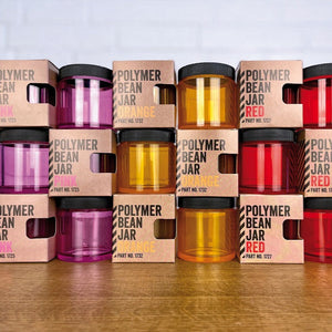 Comandante Polymer Bean Jar Bohnenbehälter in Orange, Pink und Rot mit Deckel und teilweise mit Verpackung