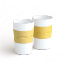Load image into Gallery viewer, Moccamaster Kaffeebecher Porzellan mit Silikonrand pastel yellow 2 Stück