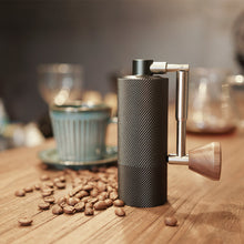 Load image into Gallery viewer, Timemore Chestnut Nano Kaffeemühle mit Kaffeebohnen und Kaffeetasse